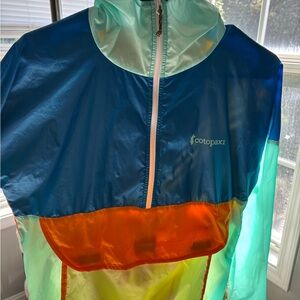 Cotopaxi Vibrant wind breaker with Blue and Orange